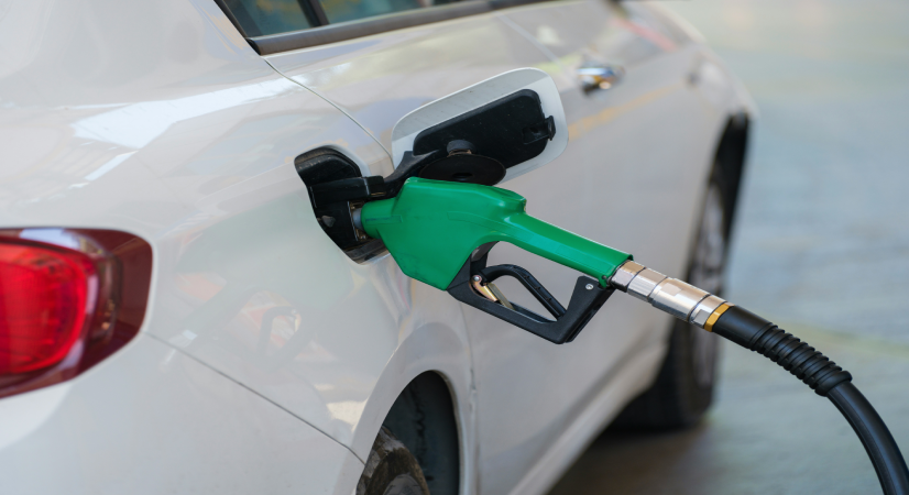 unsplash.com/photos/a-white-car-with-a-green-gas-pump-ATiv-MR0d4U